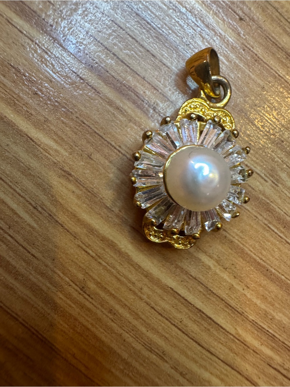 Gold plated pendant with pearl center and baguette CZ stones